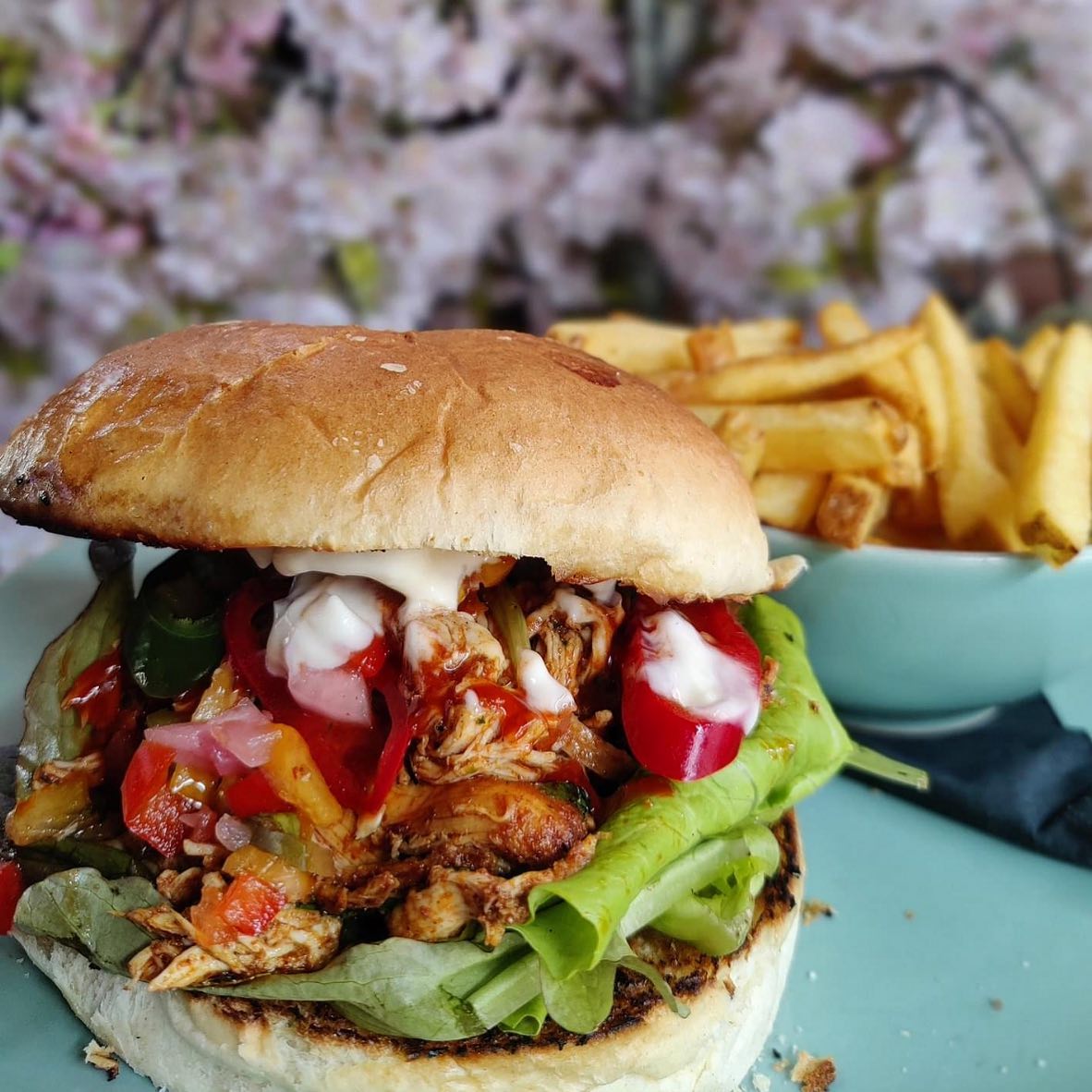 Todays mouth watering special 🤤HAPPY FRIDAY Welcome to the weekend the milky bars are on me.🤠Mexican Inspired Chicken burger Pulled chicken, lettuce , salsa, hot sauce with fresh chillies served in a brioche bun with a choice of side order. Food served from 12pm ‍